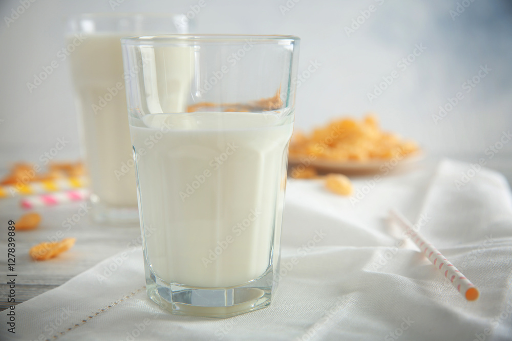 Delicious milkshake in glass on table