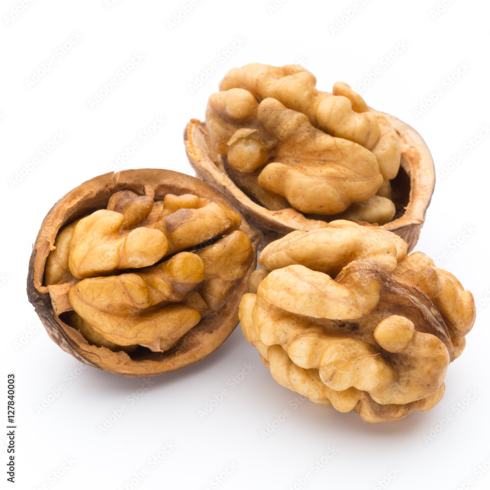 Walnut and walnut kernel isolated on the white background. Walnut and walnut kernel isolated on the white background.