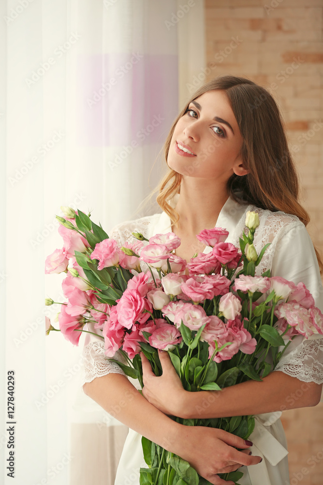 Pretty girl holding big bouquet of eustoma flowers Pretty girl holding big bouquet of eustoma flowers