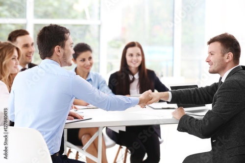 Business people shaking hands at office