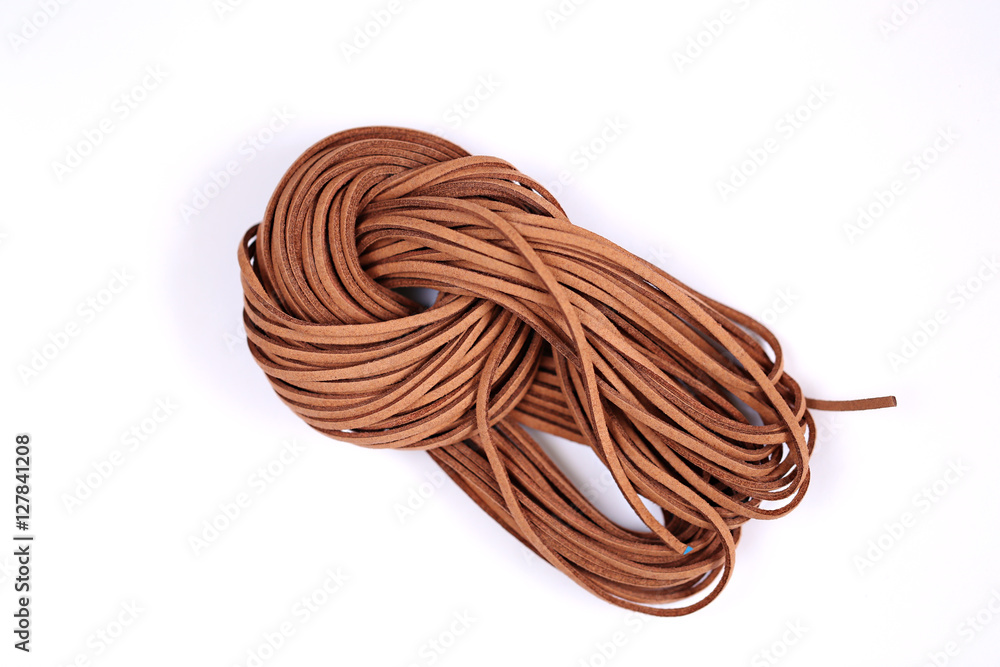 brown leather cord isolated on white background. hank 3