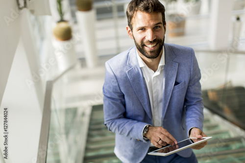 Young businessman with tablet