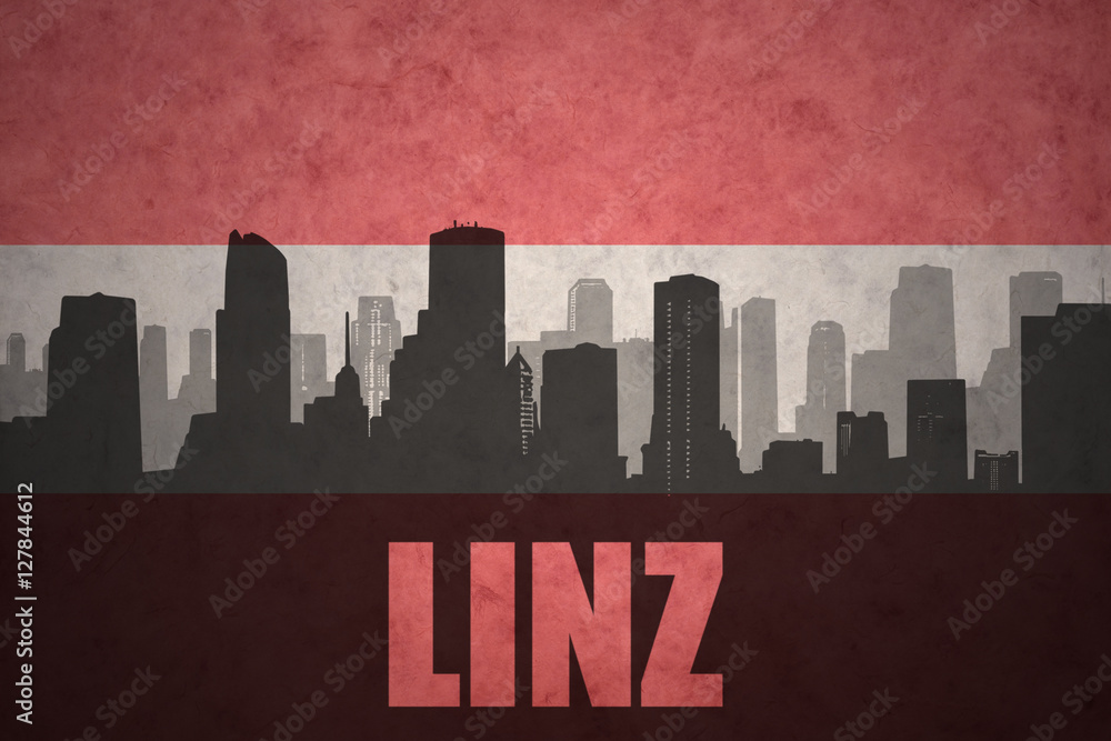 abstract silhouette of the city with text Linz at the vintage austrian flag