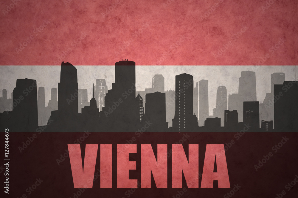abstract silhouette of the city with text Vienna at the vintage austrian flag