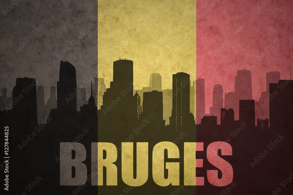abstract silhouette of the city with text Bruges at the vintage belgian flag