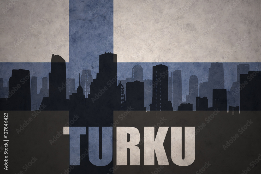 abstract silhouette of the city with text Turku at the vintage finnish flag