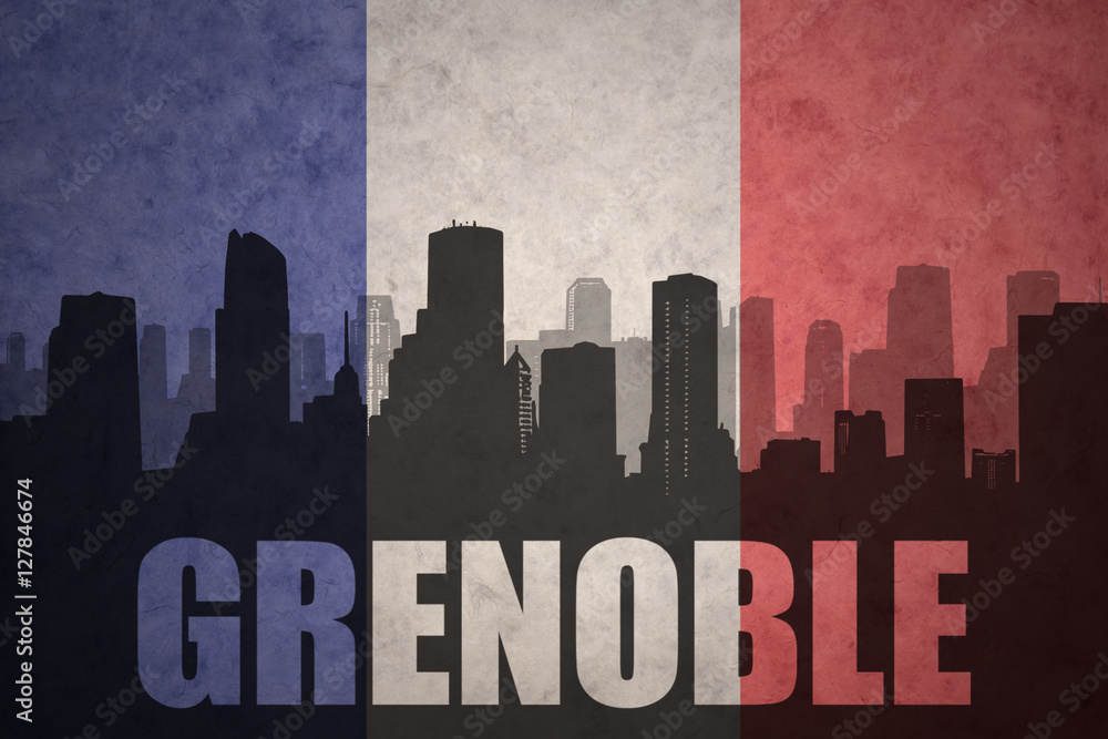 abstract silhouette of the city with text Grenoble at the vintage french flag
