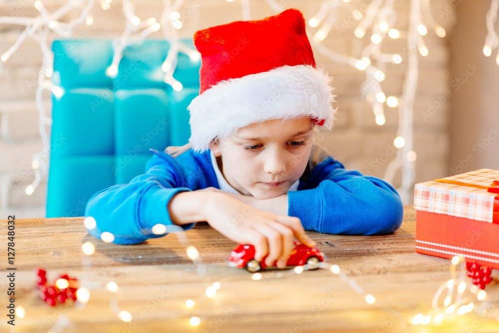 Child playing with toy from Santa Claus at home Child playing with toy from Santa Claus at home