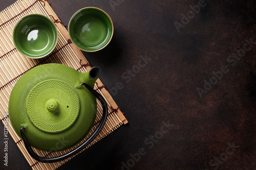 Green teapot and tea cups
