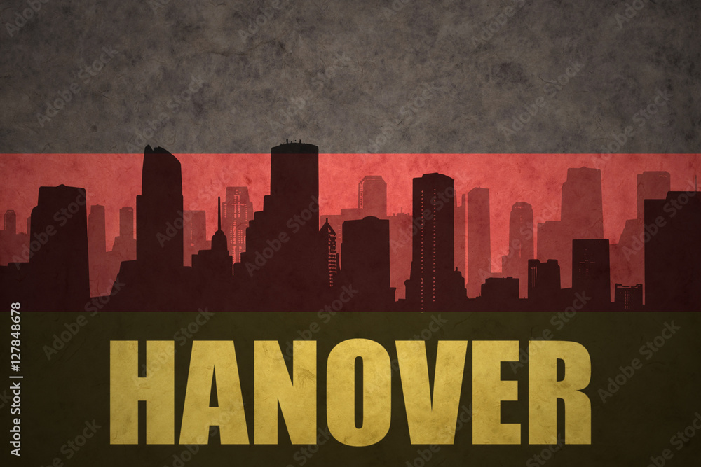 abstract silhouette of the city with text Hanover at the vintage german flag