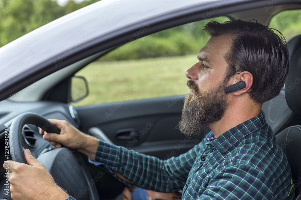 man speaking on the mobil phone using headset
