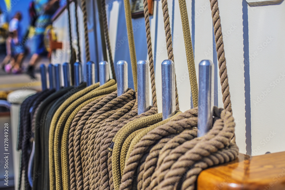Obraz premium Coiled rope on a ship deck