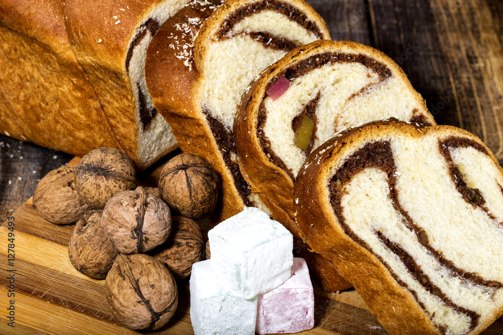 Slices of Romanian sponge cake, walnuts and fruit jelly