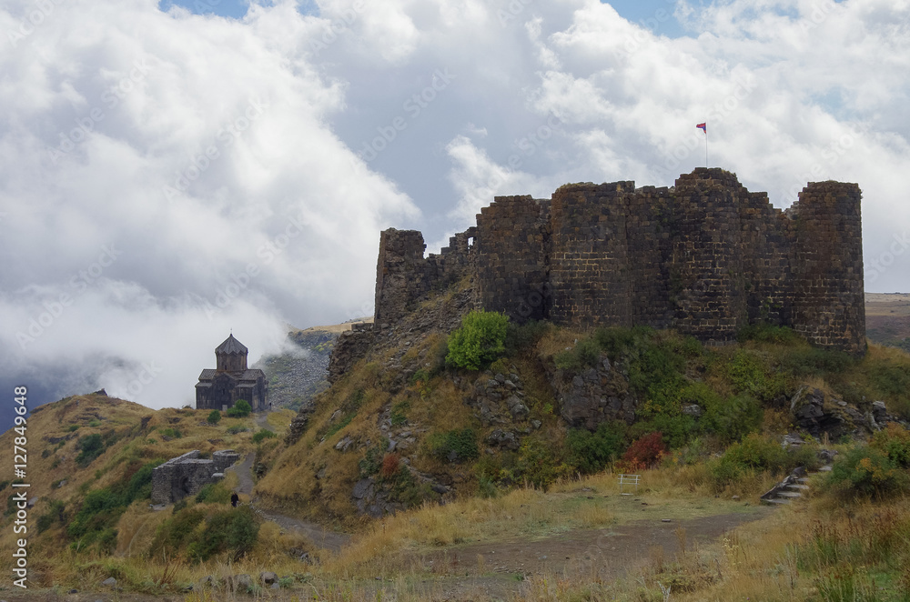 Amberd fortress and St. Astvatsatsin (Holy Mother of God) Church in slope of Aragats mountain in the clouds. Armenia