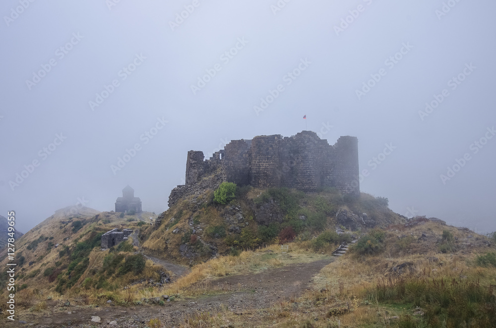 Amberd fortress and St. Astvatsatsin (Holy Mother of God) Church in slope of Aragats mountain in the clouds. Armenia