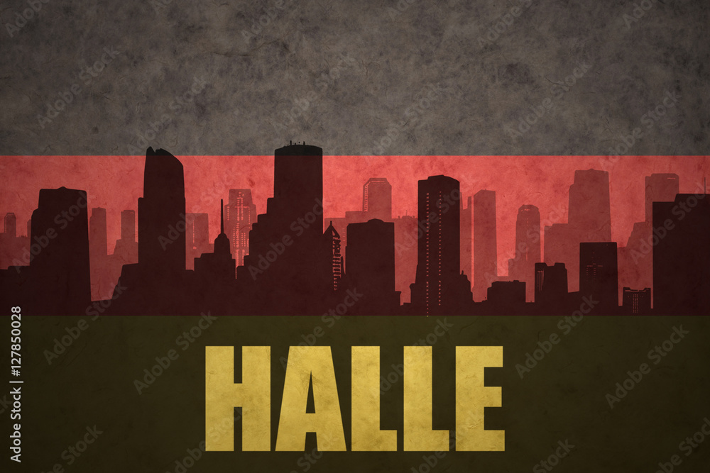 abstract silhouette of the city with text Halle at the vintage german flag