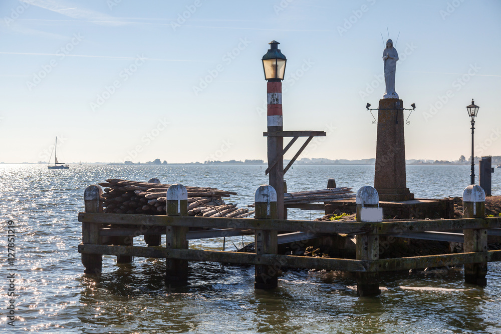 Lighthouse in the bay of the city Volendam, Netherlands
