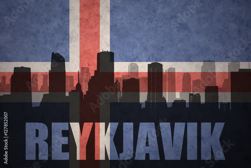 abstract silhouette of the city with text Reykjavik at the vintage icelandic flag photo