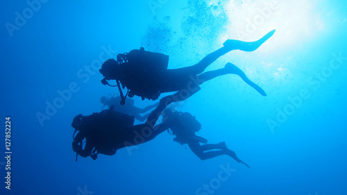 Canvas Print Silhouette scuba diving.