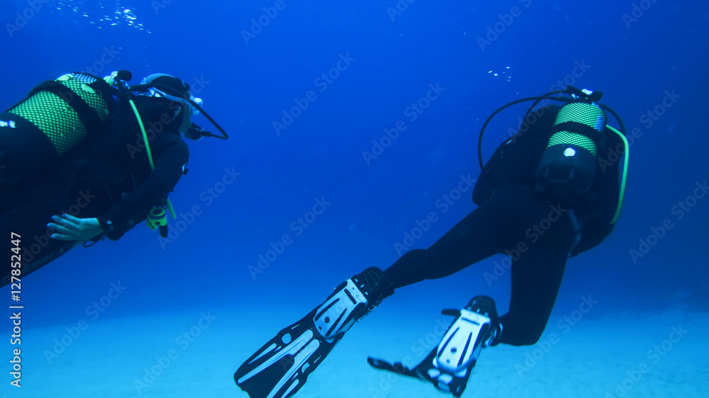 Silhouette scuba diving.