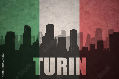 abstract silhouette of the city with text Turin at the vintage italian flag