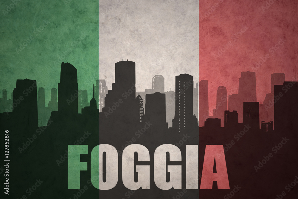 abstract silhouette of the city with text Foggia at the vintage italian flag