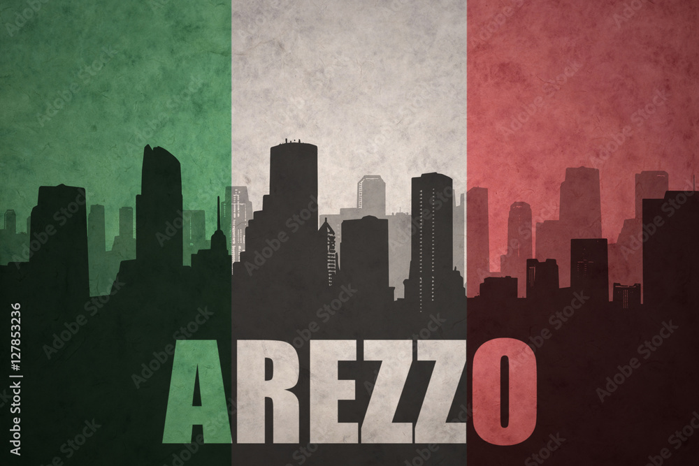 abstract silhouette of the city with text Arezzo at the vintage italian flag