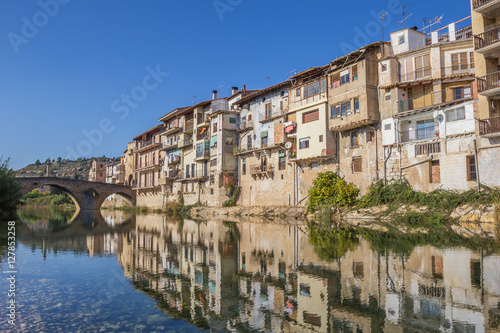 Reflection of old houses in the river of Valderrobres © venemama