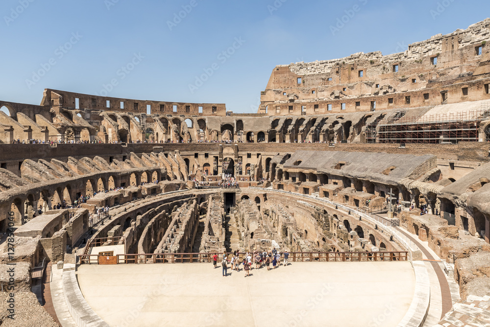 Interior view of Colosseum in a sunny day in Rome. The Colosseum is the most well-known landmark in Rome.