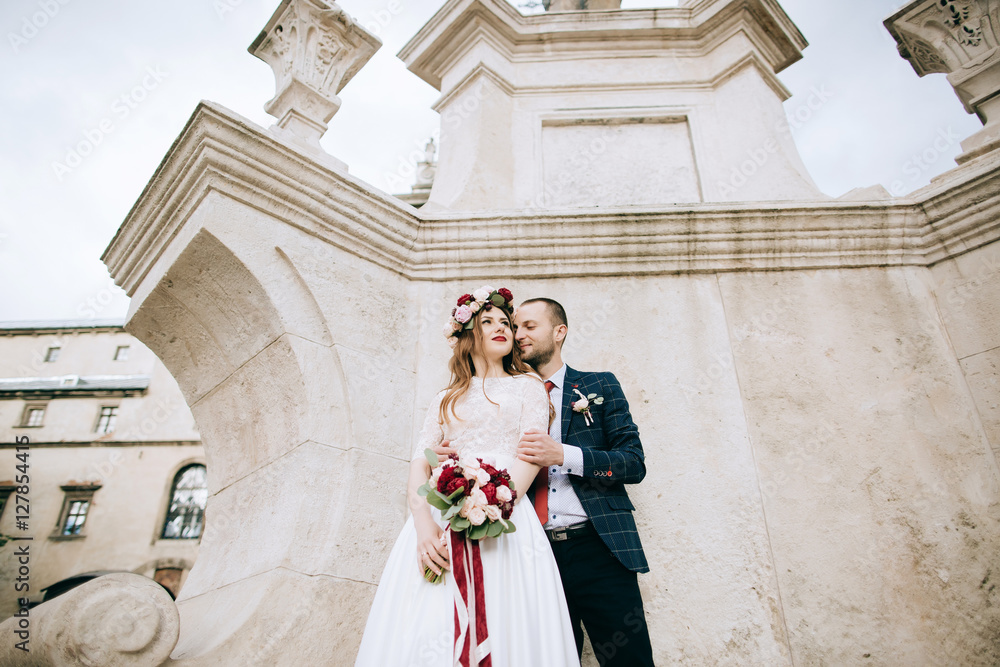 bride and groom celebrating their marriage on the  old city in Europe. wedding concept