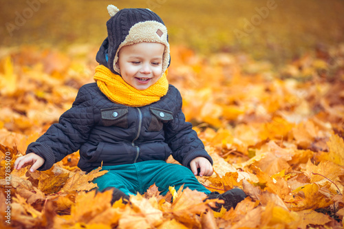 little boy in autumn park