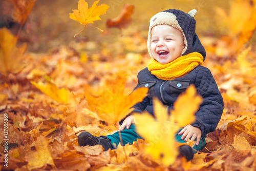 little boy in autumn park