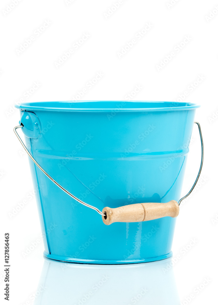 Blue iron/metal bucket/pail/container with handle isolated on white background. Colorful kid child toys. Garden equipment. Side view. Blue iron/metal bucket/pail/container with handle isolated on white background. Colorful kid child toys. Garden equipment. Side view.