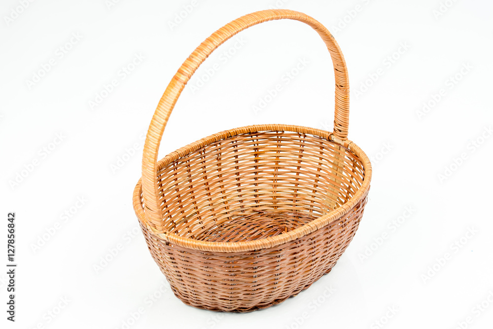 Empty wooden woven fruit or bread basket on white background. Wicker basket.  Plaited container. Pink/red color. Top, side view. Stock Photo | Adobe Stock