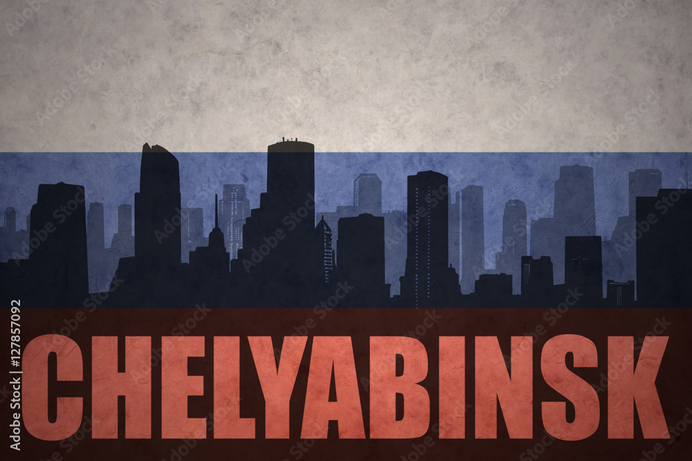 abstract silhouette of the city with text Chelyabinsk at the vintage russian flag