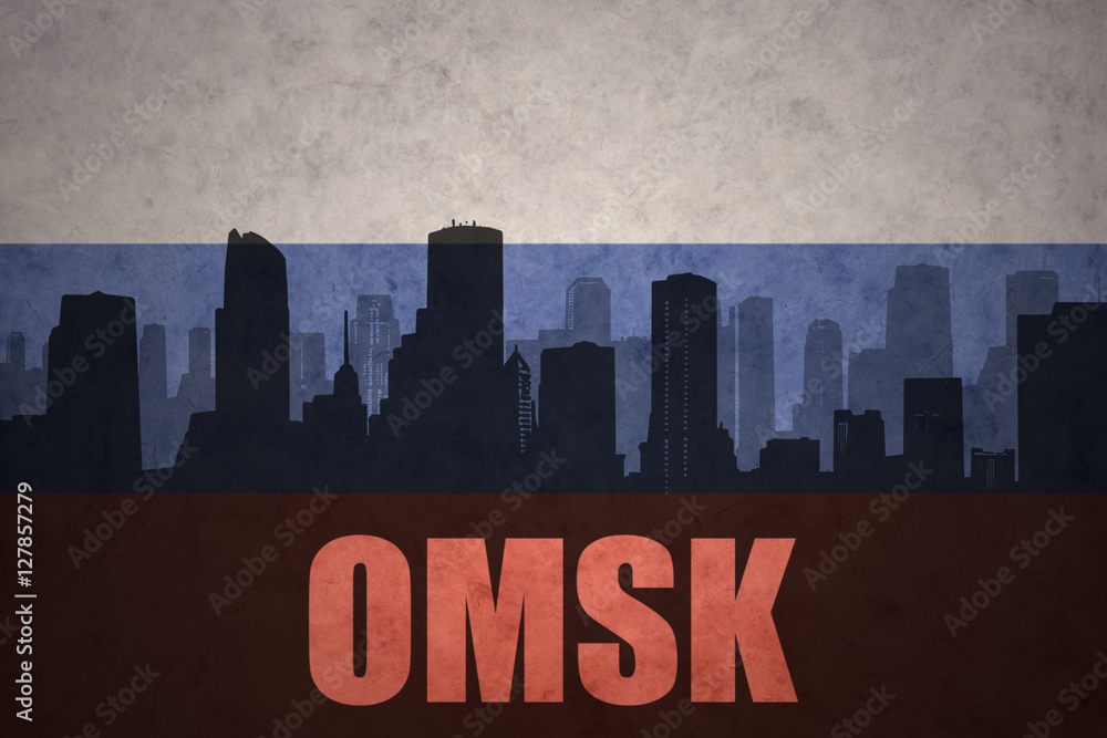 abstract silhouette of the city with text Omsk at the vintage russian flag
