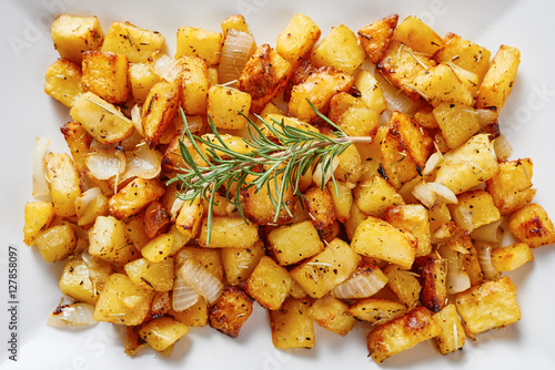 Baked potatoes on square white dish