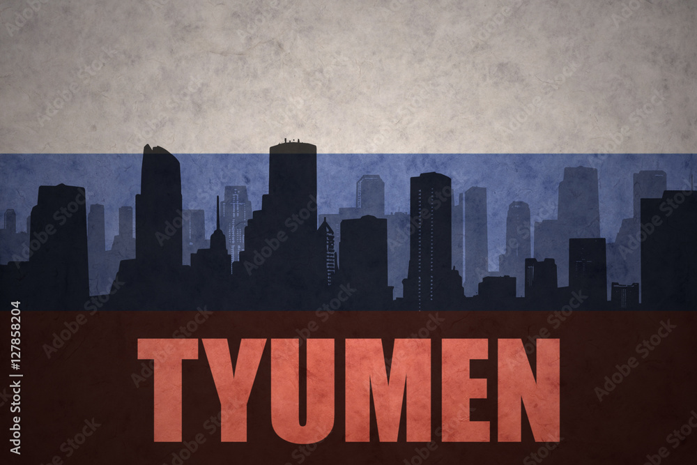 abstract silhouette of the city with text Tyumen at the vintage russian flag