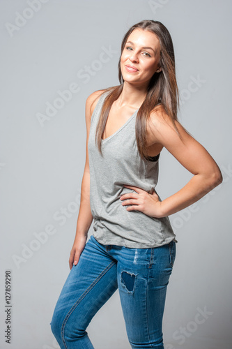 brunette femal on a grey background