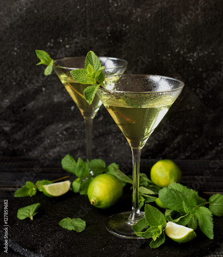 Martini or mint liqueur with lime, selective focus