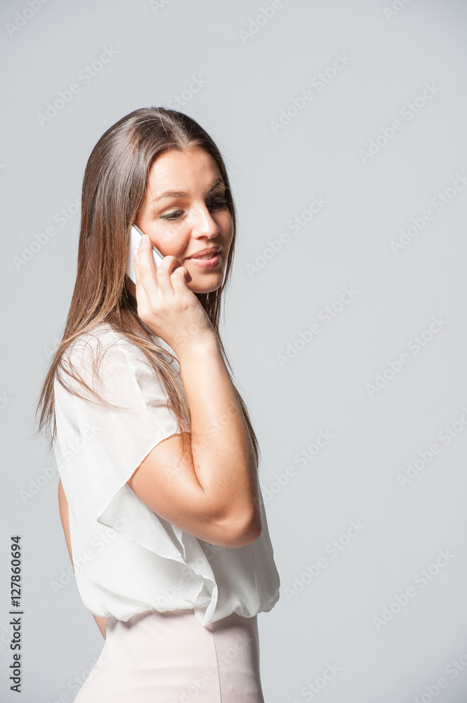 Portrait of smiling young business woman holding a phone Portrait of smiling young business woman holding a phone