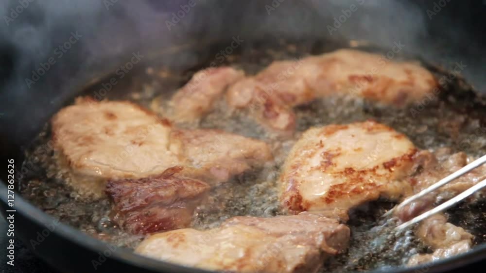 frying chicken with oil splashing all over the place frying chicken with oil splashing all over the place