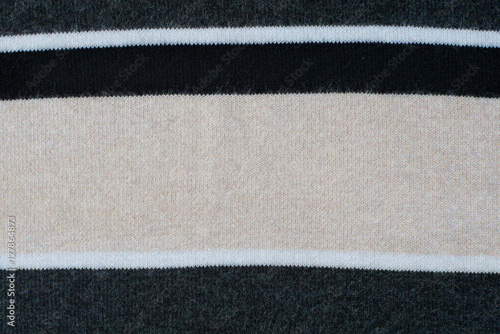 Fototapeta premium Knitwear striped in grey, black, beige, white. Textured backgrou