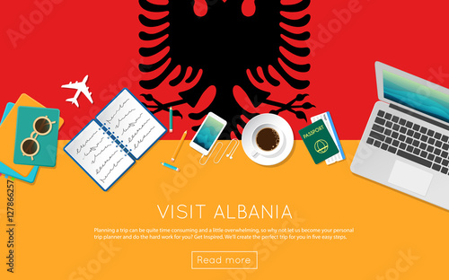 Visit Albania concept for your web banner or print materials. Top view of a laptop, sunglasses and coffee cup on Albania national flag. Flat style travel planninng website header.