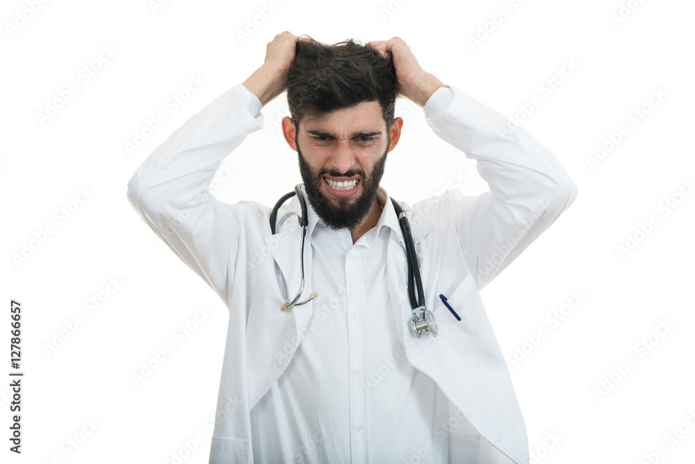 Closeup portrait of rude frustrated upset overwhelmed, angry young doctor Closeup portrait of rude frustrated upset overwhelmed, angry young doctor