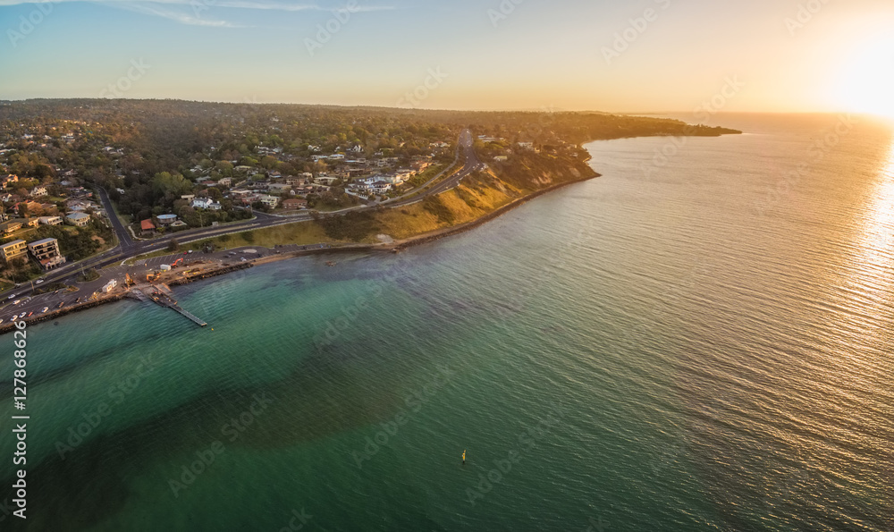 Aerial panorama of Mornington Peninsula coastline and Nepean Highway at Sunset. Frankston, Victoria, Australia.