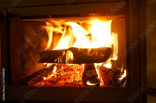 Firewood burning in the fireplace. Seen only the flames covering