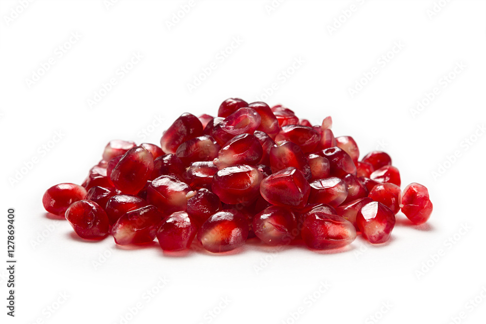 Fruit pomegranate seeds isolated on a white background side view closeup. Fruit pomegranate seeds isolated on a white background side view closeup.