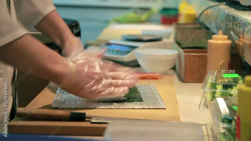 Cooking Of Salmon Sushi Roll In Catering.
Cooking Of Salmon Sushi Roll In Catering.
