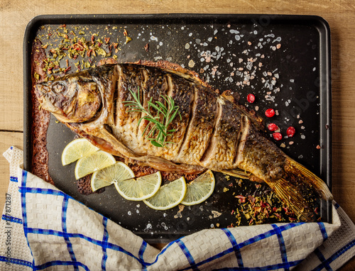 baked carp with spices top view